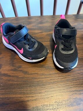 Nike Kids Black Sneakers with Pink Swoosh